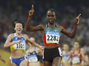 Langat of Kenya gestures as she crosses the finish line to win the women's 1500m final at the Beijing 2008 Olympic Games