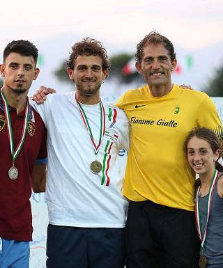 Daniele Cavazzani, al centro, tra Daniele Greco e Fabrizio Donato (Foto G. Colombo/FIDAL)